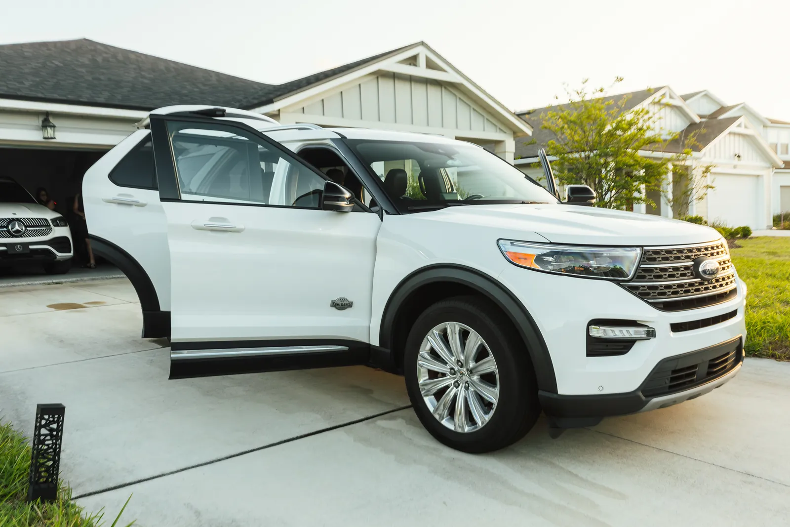 Freshly detailed white Ford Explorer in a Jacksonville driveway