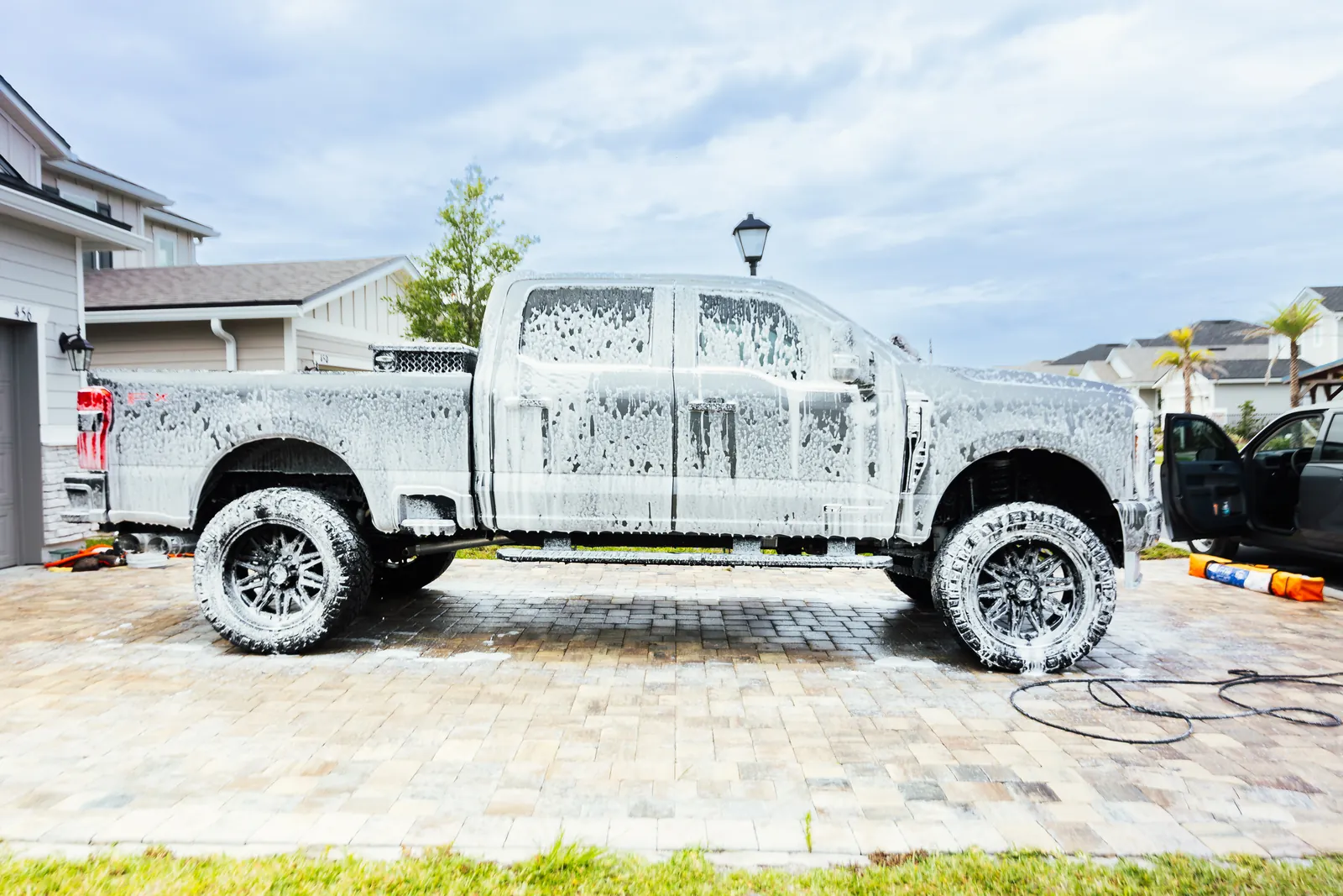 Ford Super Duty snow foam wash during mobile detail
