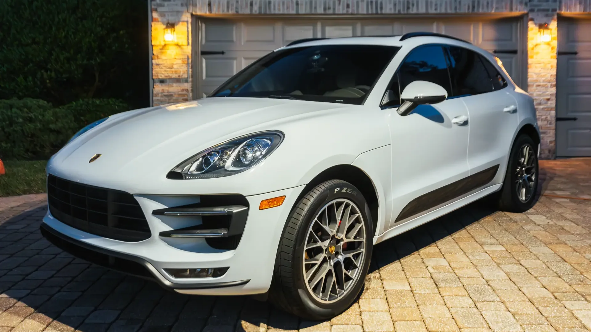White Porsche Macan with a high-gloss exterior finish after mobile detailing